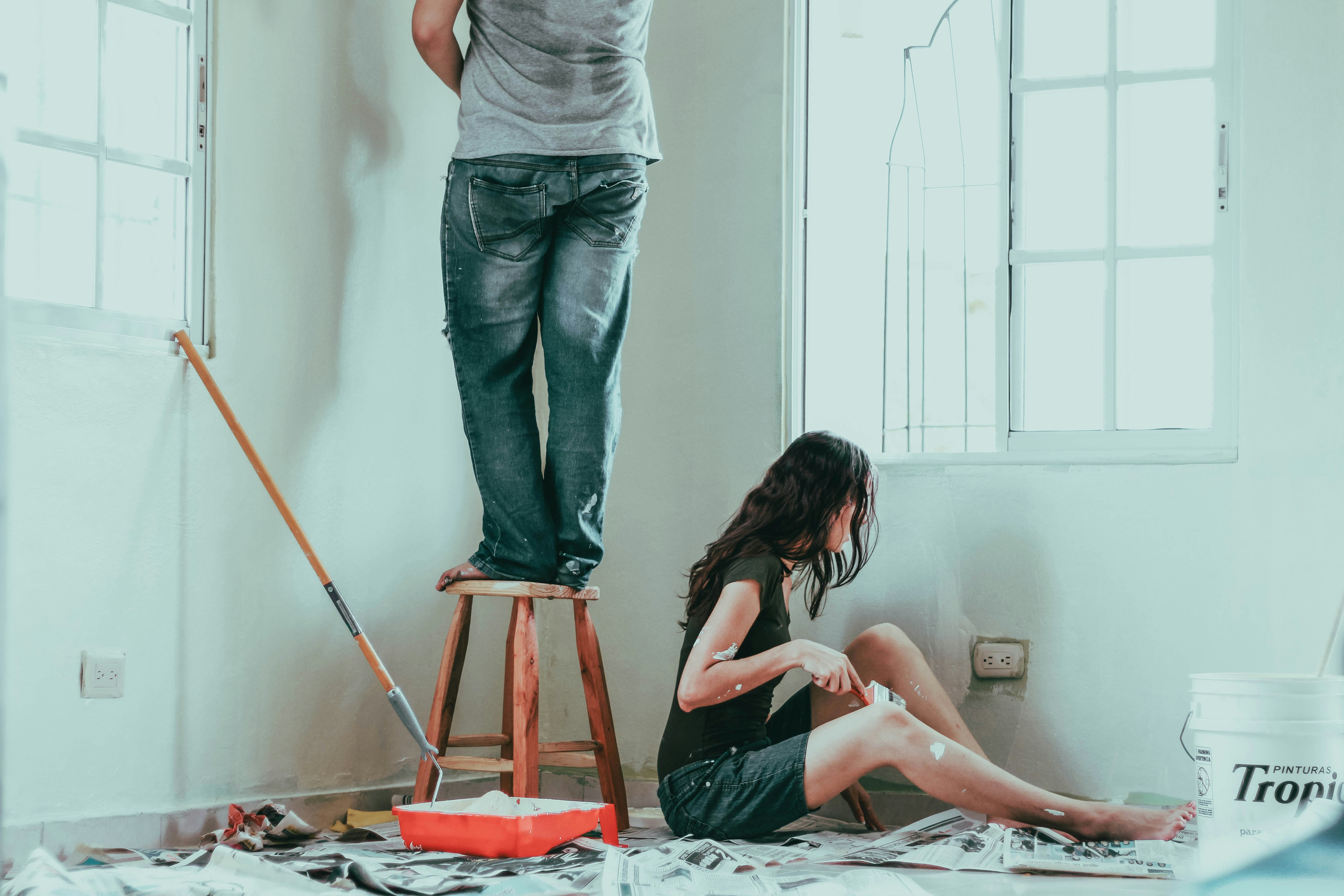 Tradespeople painting and renovating a home interior